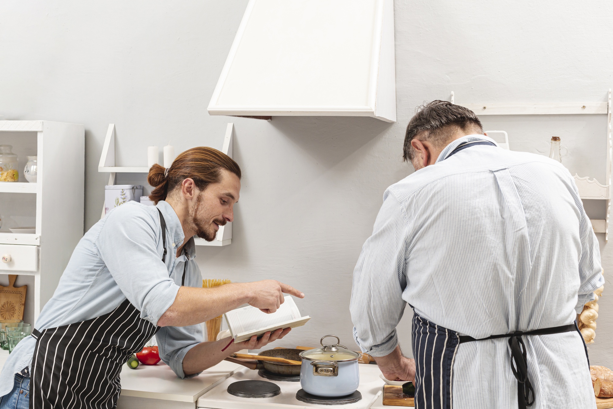 Chef inviting guests into small kitchen workshop
